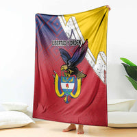 Draped flag-style folk blanket featuring Colombia crest, red and blue diamond pattern