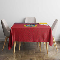 Red folk-pattern tablecloth with Colombian crest centerpiece and yellow border panel