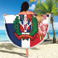 Round beach blanket with white fringe, Dominican crest on red/white/blue background with flowers