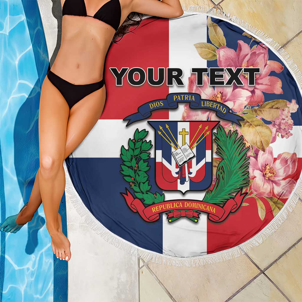 Round beach blanket with fringe border, custom text over Dominican crest and floral artwork