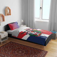 Personalized bedding set on bed with red, white, and blue flag design, crest emblem, custom text