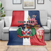 Personalized flag blanket on gray couch, red white navy stripes with floral crest