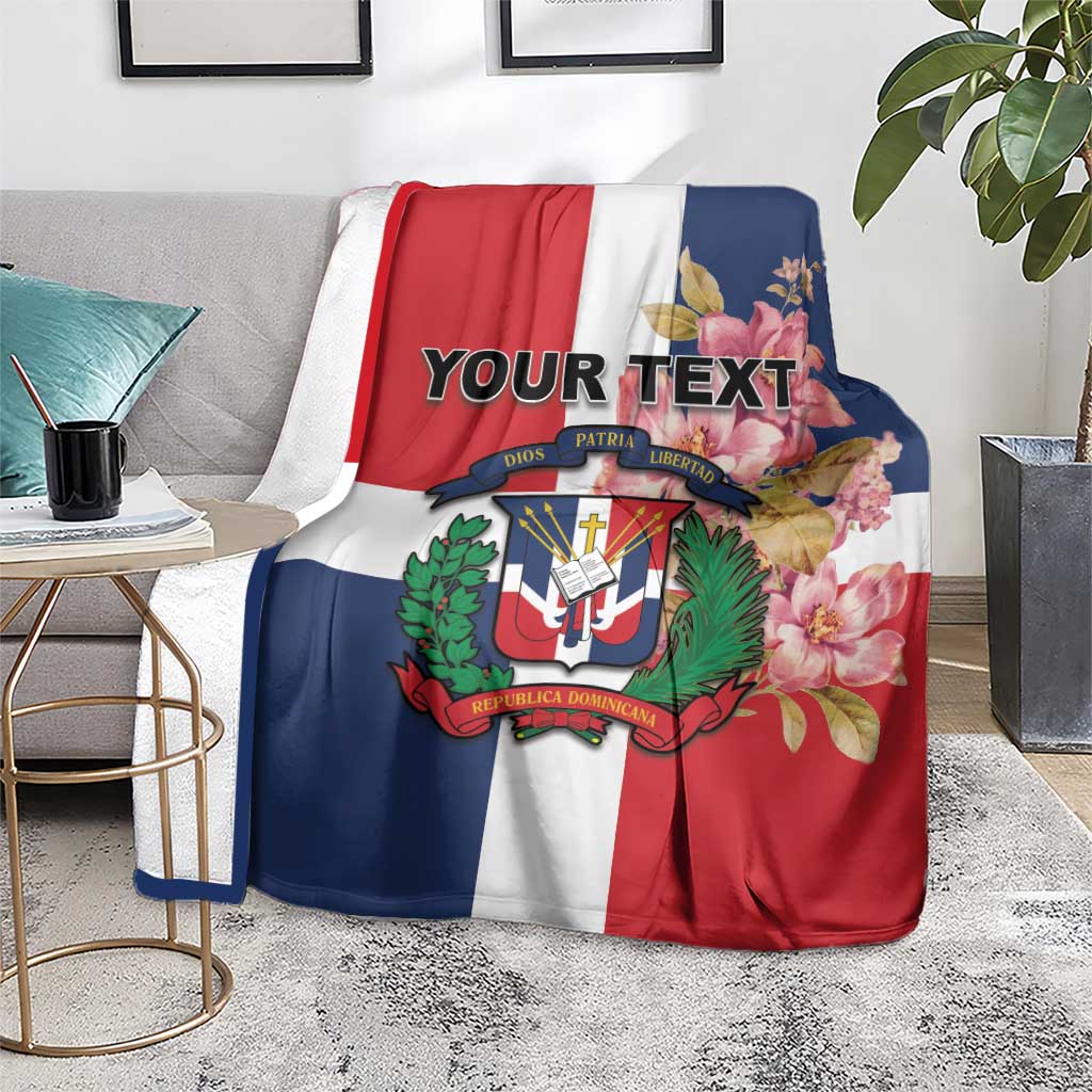 Personalized flag blanket on floor, red white navy panels with floral crest and custom text