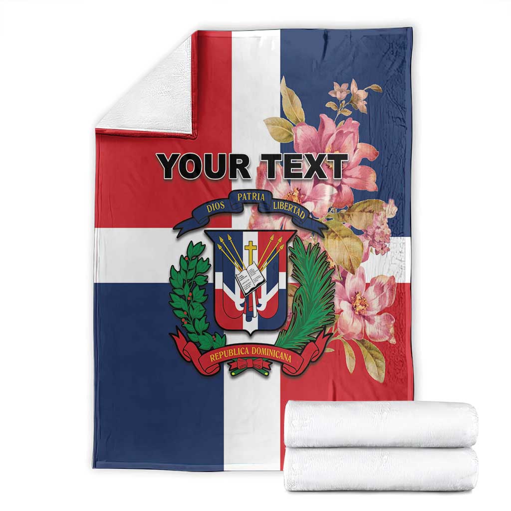 Folded personalized flag blanket, red white and navy panels with floral crest and custom text