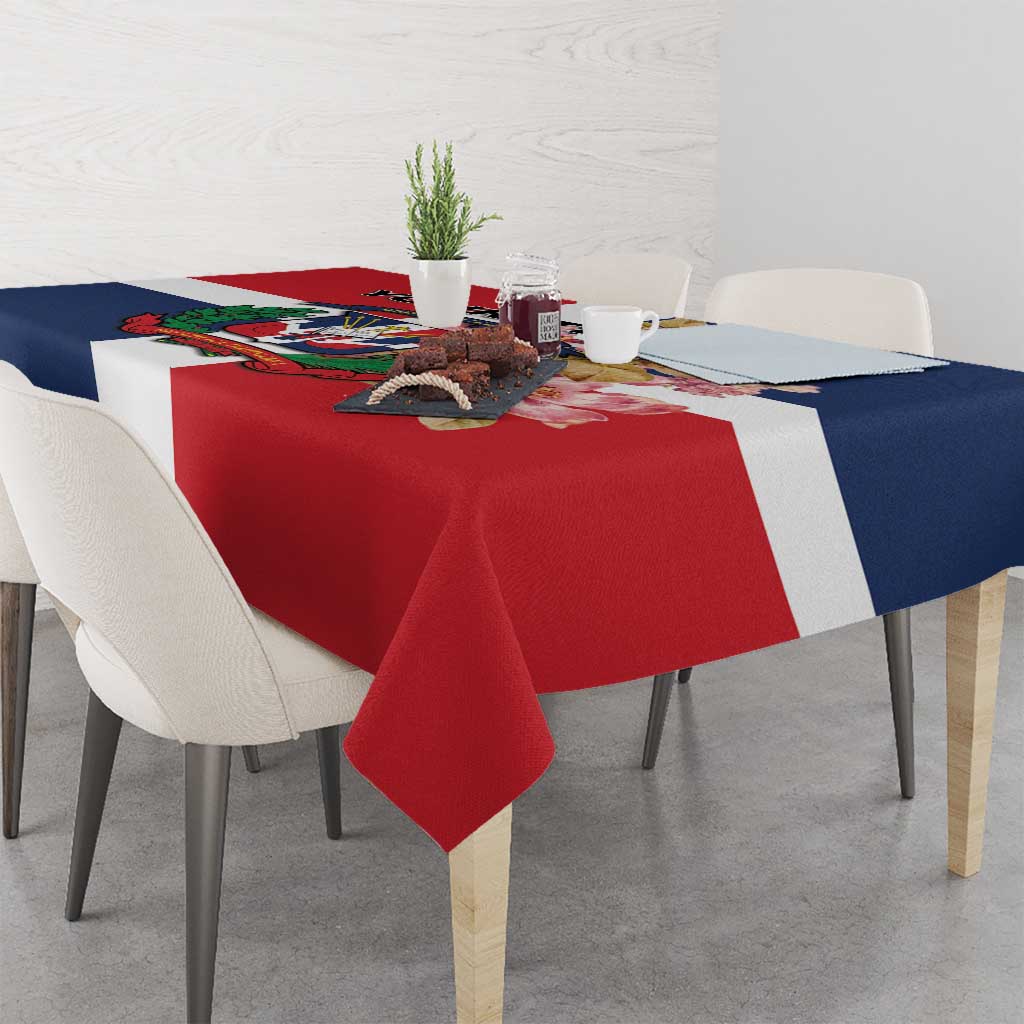 Red tablecloth with navy sides and white stripe, with colorful printed design