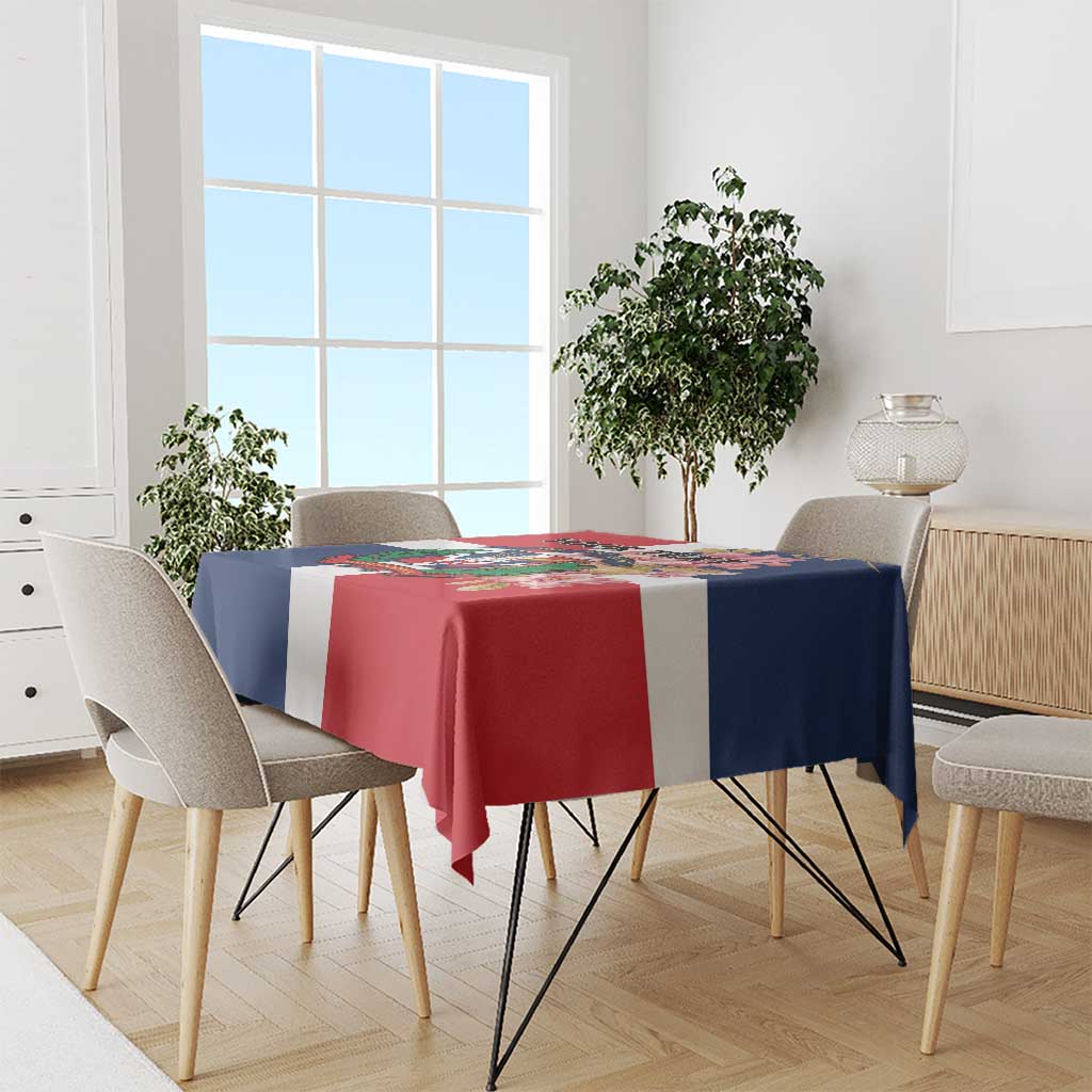 Red, navy and white printed tablecloth featuring colorful emblem on dining table