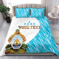 Personalized bedding set with white and bright blue flag graphic, crest, “YOUR TEXT”