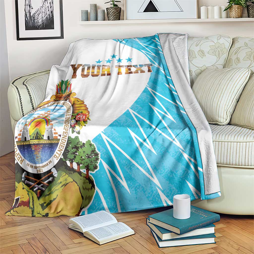 Personalized Honduras blanket flag draped on sofa, white with blue diagonal rays and crest