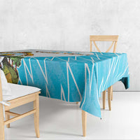 Personalized tablecloth with blue geometric flag pattern and Honduras crest on table