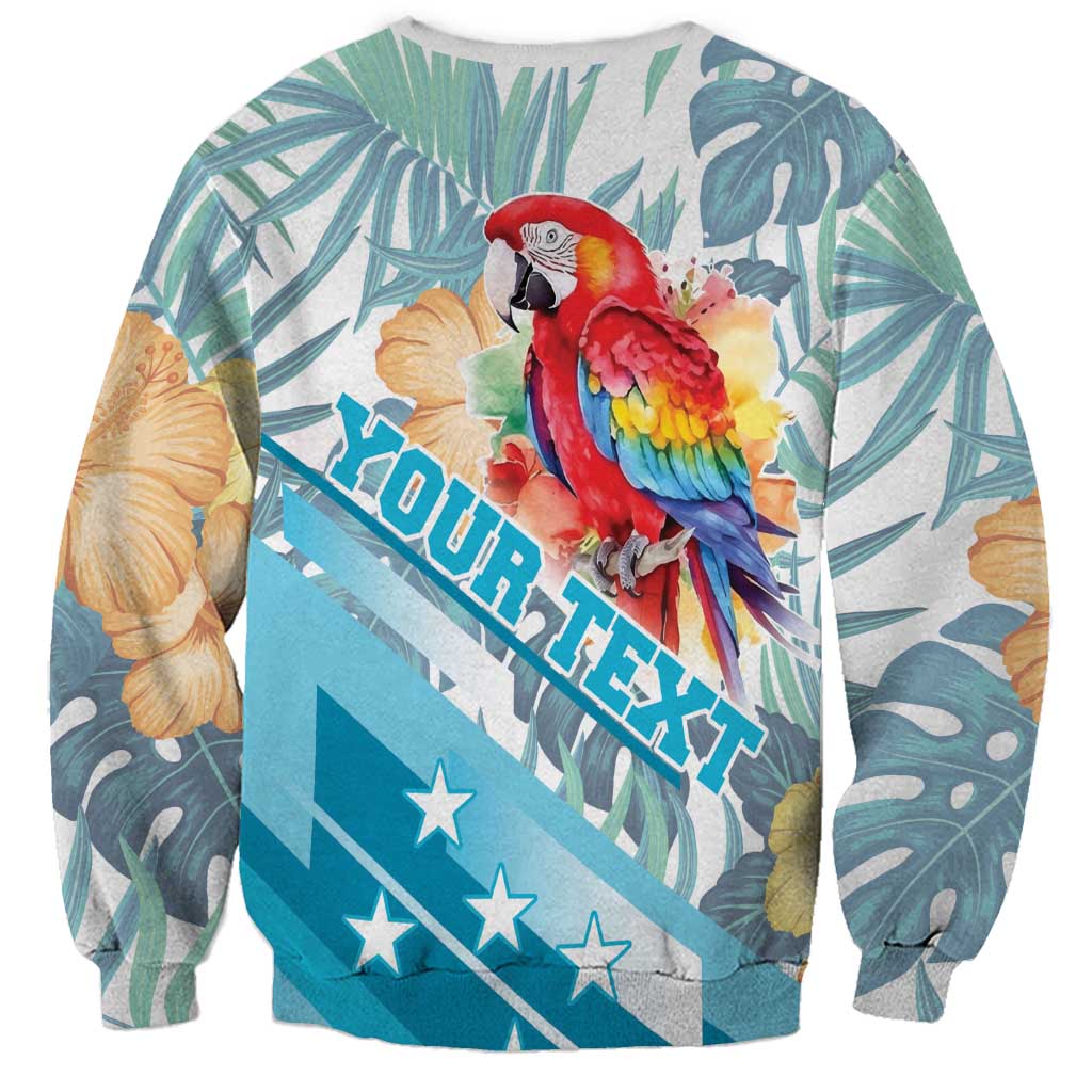 Unisex tropical sweatshirt with macaw and hibiscus, teal leaf print, diagonal tropical lettering