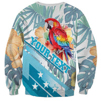 Unisex tropical sweatshirt with macaw and hibiscus, teal leaf print, diagonal tropical lettering