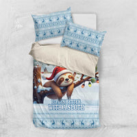 Blue sloth-themed Christmas bedding set flat lay with duvet and two matching pillowcases