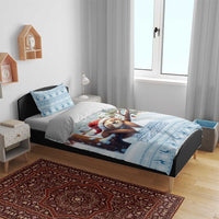 Blue sloth Christmas bedding set with duvet and two pillows featuring sloth Santa hat artwork