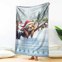 Blue sloth holiday blanket draped on a living room floor with Santa sloth