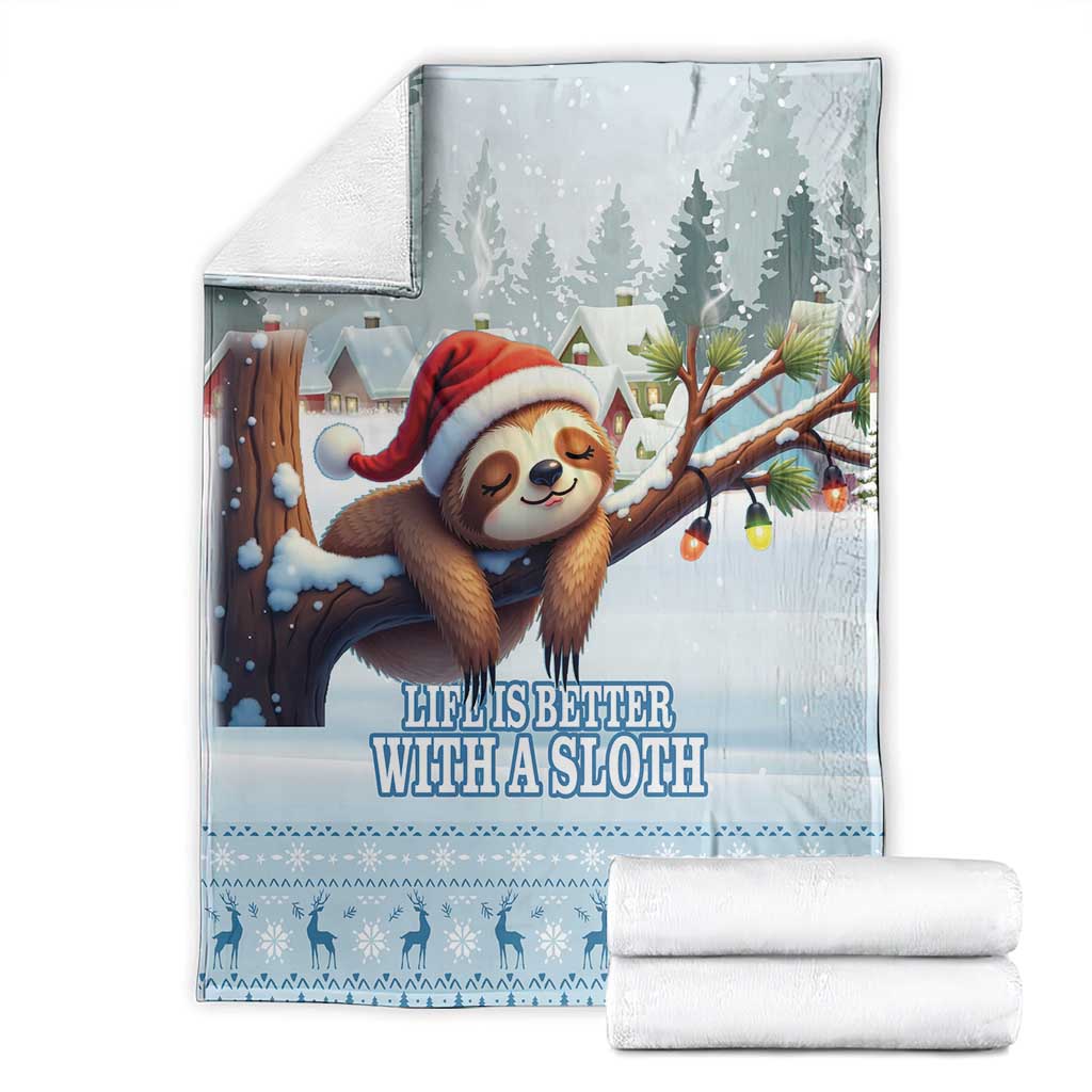 Blue sloth holiday blanket with Santa sloth design, shown with folded white rolled towels