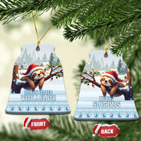 Blue ceramic ornaments set: bell-shaped front and back views with Santa sloth artwork.