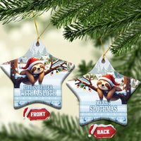 Blue ceramic star-shaped sloth ornaments hanging, Santa hat sloth with snowy trees.