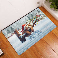 Blue rubber doormat with snowy holiday scene featuring a sloth in a Santa hat