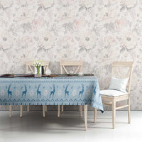 Blue winter silhouette tablecloth with decorative border on dining table setting