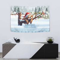 Blue winter sloth tapestry featuring sloth in a red hat, trees, and 'Life is better with a sloth'