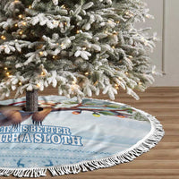 Blue circular tree skirt with sloth holiday scene and white tassel fringe border