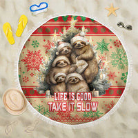 Round beach blanket with sloth family holiday print, red-green pattern, fringe edge, text