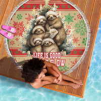 Round beach blanket with sloth family holiday print, fringe edge, red-green snowflake pattern