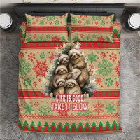 Red, green, and cream Christmas sloth bedding set with “Life Is Good Take It Slow” text