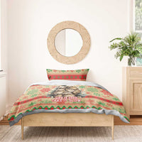 Christmas bedding set with sloth artwork on red, green, and cream cover reading “Take It Slow”