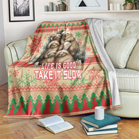 Red Christmas blanket with sloth graphic and 'Life is Good, Take it Slow' text