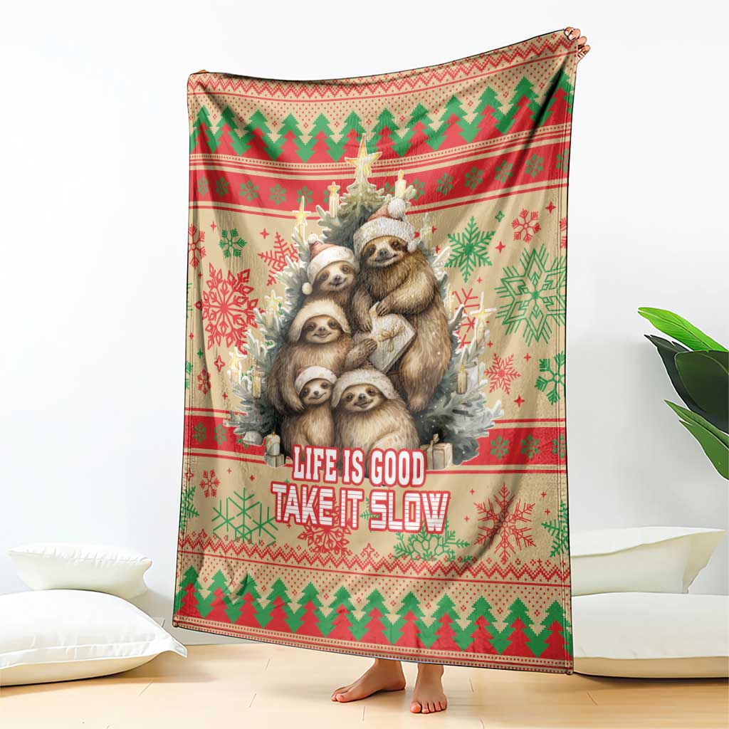 Red Christmas blanket with sloth family graphic and 'Life is Good Take it Slow' text