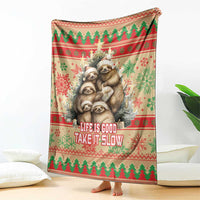 Red Christmas blanket with sloth family graphic and 'Life is Good Take it Slow' text