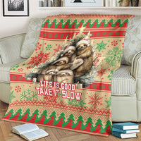 Red Christmas blanket with large sloth graphic and 'Life is Good Take it Slow' text