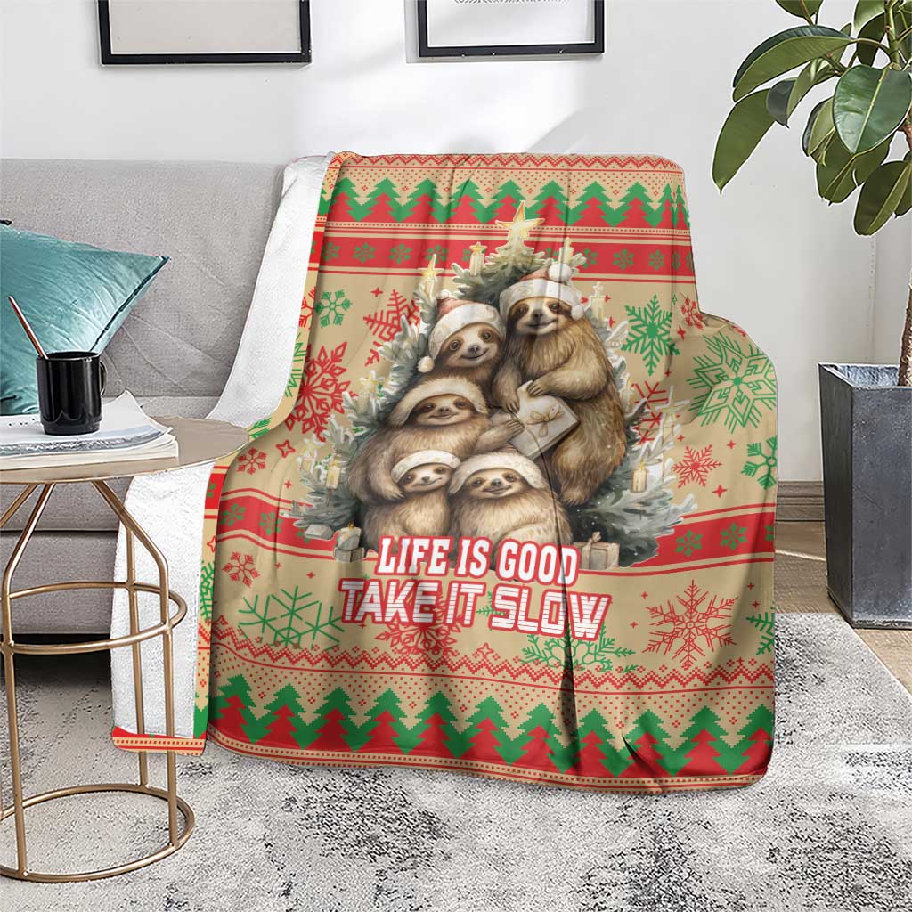 Red Christmas blanket featuring sloth graphic with 'Life is Good Take it Slow' text