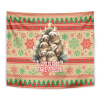 Full view Christmas sloth tapestry with snowflake motifs and “Life is good, take it slow”