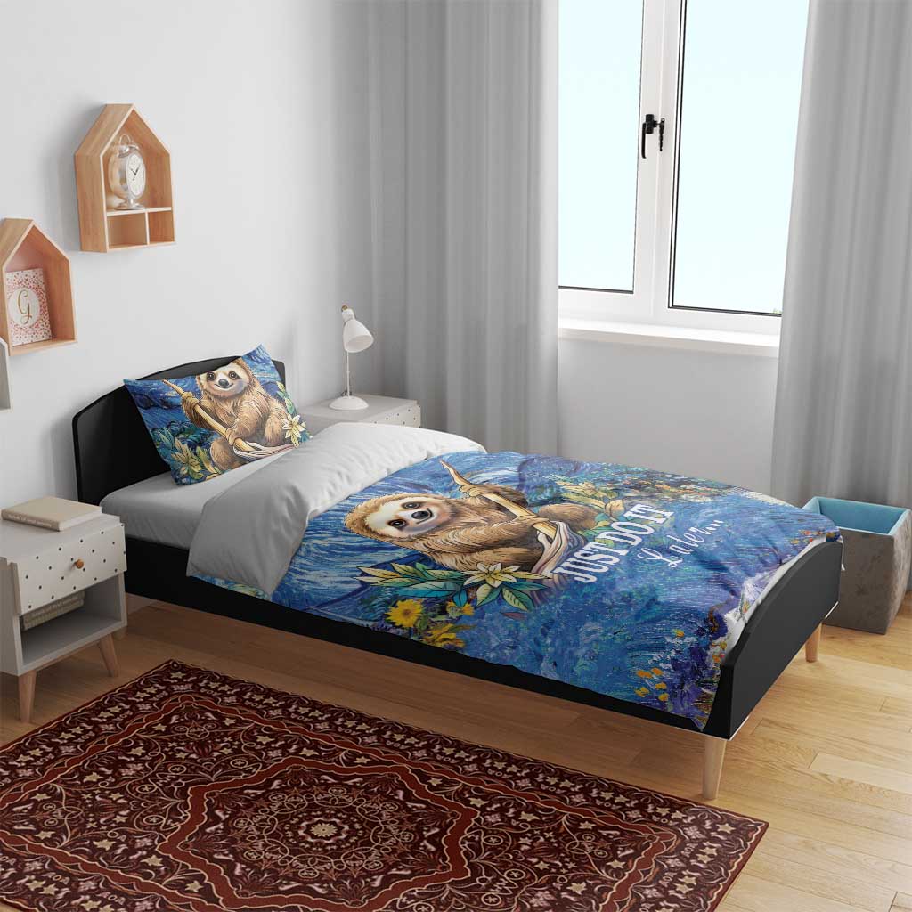 Blue sloth bedding set on a bed with matching pillows, swirl night pattern, and “JUST DO IT Later”