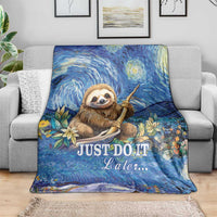 Blue sloth blanket draped over sofa, featuring starry night swirls and "JUST DO IT Later..."