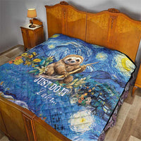 Blue sloth quilt on bed, floral starry design and "Just Do It Later..."