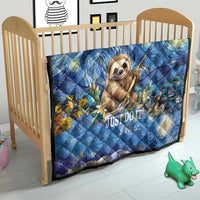 Blue sloth quilt in wooden crib, starry floral design with "Just Do It Later..."