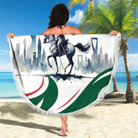 Round Saudi flag horse rider beach blanket with fringed border, held open on sand