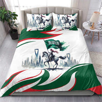 Bedding set with white, green and red horse rider skyline design, on a bed with 2 pillows