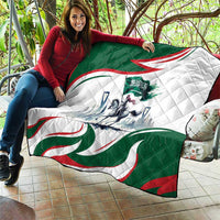 Green, white, and red quilt with quilted texture and Arabian horse rider graphic