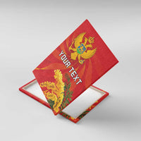 Red canvas wall art with coat of arms, mimosa flowers, and custom text; angled view