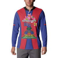 Blue and red button sweatshirt with Haiti coat of arms front graphic and black collar.