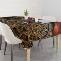 Dark Aztec patterned tablecloth draped over dining table with hanging corner