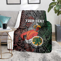 Personalized Aztec warrior blanket draped on sofa with Your Text red and green tribal art.
