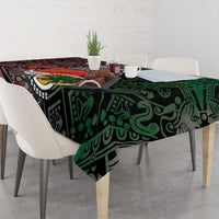 Black Aztec tablecloth with green tribal pattern and warrior sun centerpiece