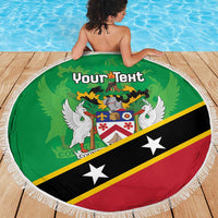 Green round beach blanket with white fringe and 'Your Text' crest, on poolside deck