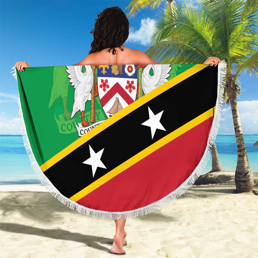 Green round beach blanket with white fringe and 'Your Text' crest, held outdoors on sand