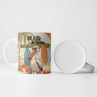 Personalized ceramic mug with pelican illustration and St. Kitts & Nevis text